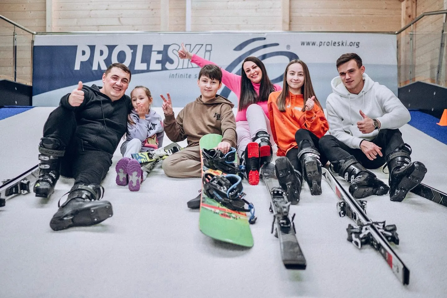 Skiing, Snowboarding and Community at a PROLESKI Club A group with skis and snowboards on a PROLESKI indoor ski simulator in Prague