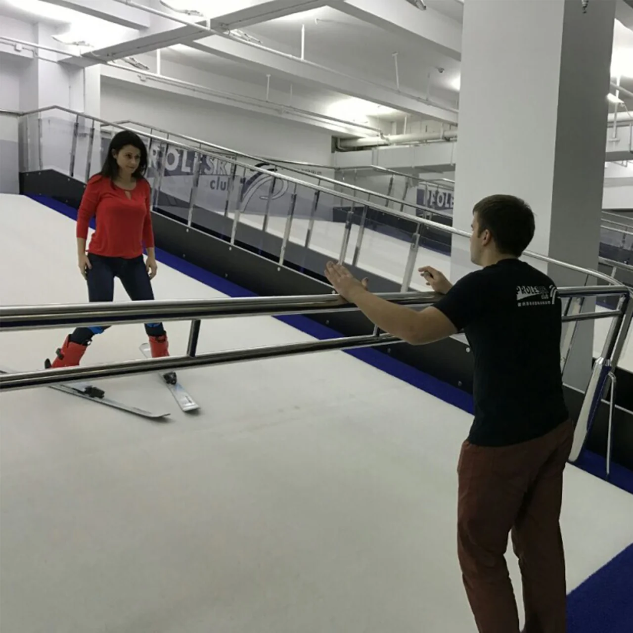 An instructor coaching a skier on a PROLESKI endless slope