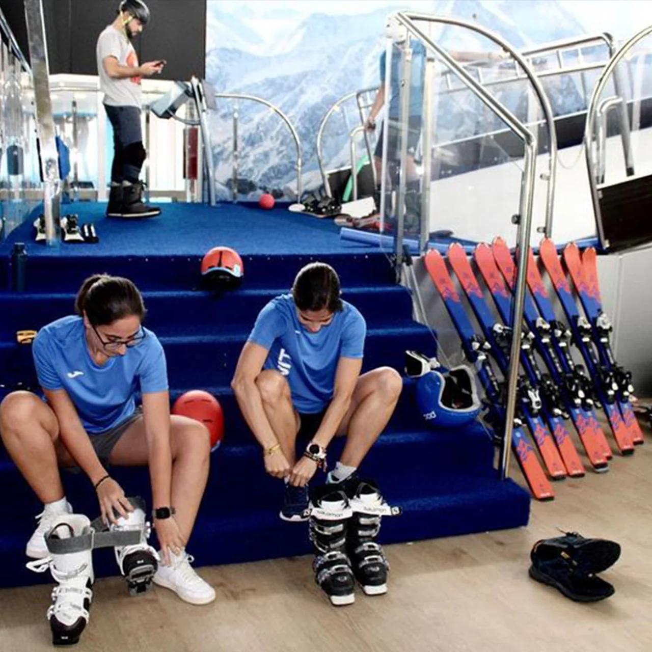 Skiers preparing for indoor training on a PROLESKI simulator